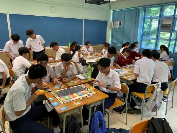 Students were playing the Stock Trading Guru board game.